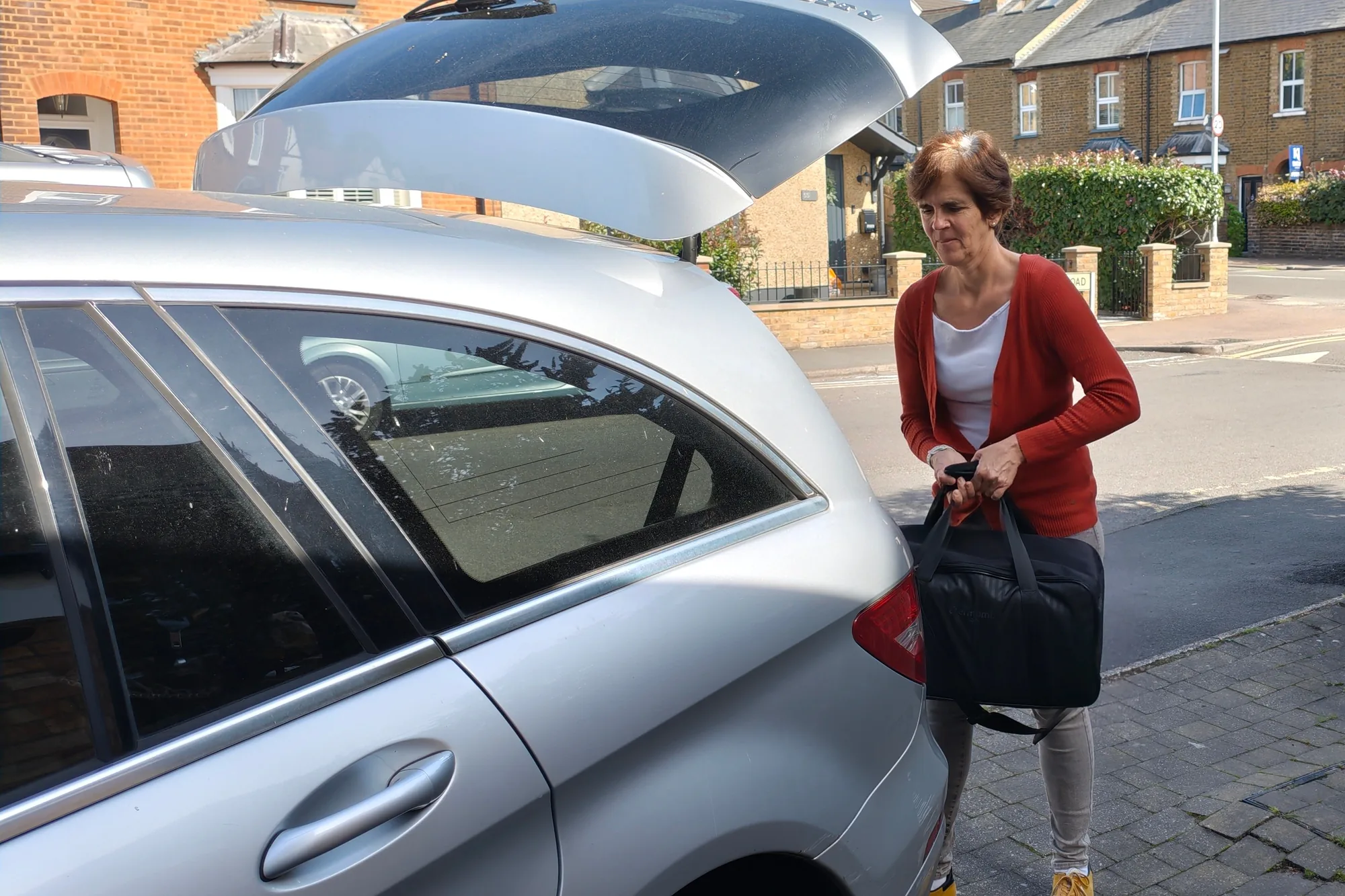 Maria packing the Thermomix TM7 into its case before a demonstration.